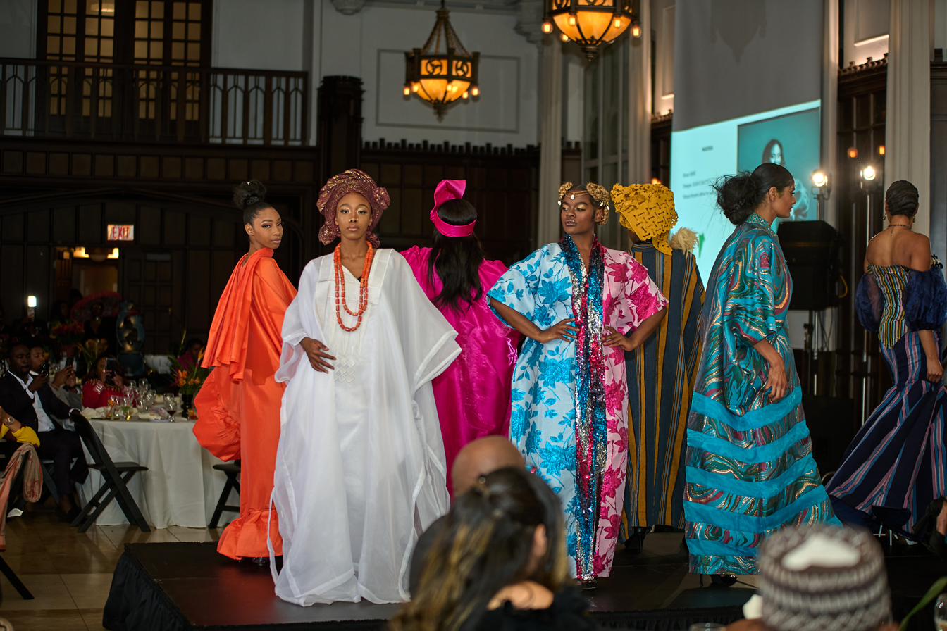 Models in vivid African textiles at a Global Africa Summit runway moment