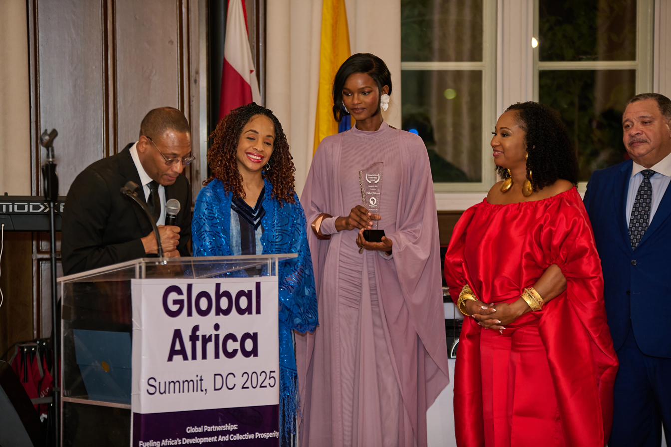 Founding leaders presenting an award at a Global Africa Summit gathering