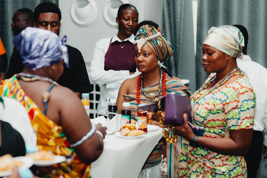 Guests in traditional West African textiles at a diaspora gathering